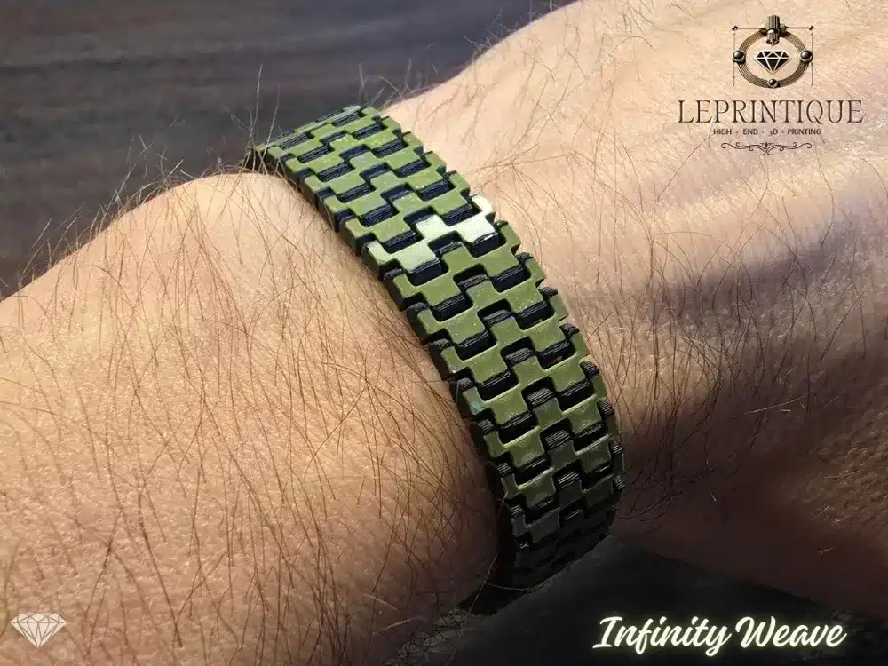 Green and black Infinity Weave bracelet on wrist, made by Leprintique.