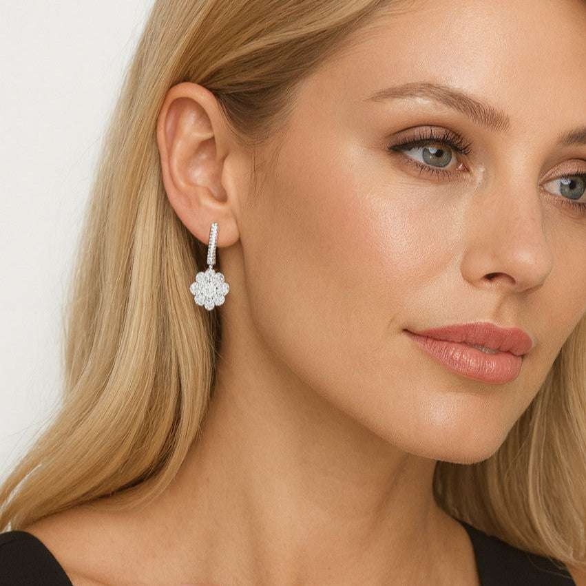 21504357-49760-Pic Close-up of a woman wearing elegant diamond drop earrings, showcasing jewelry detail on blonde hair and neutral makeup. | Sky Rye Design Close-up of a woman wearing elegant diamond drop earrings, showcasing jewelry detail on blonde hair and neutral makeup.
