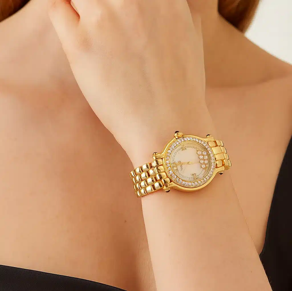22158064-51241-pic Gold wristwatch with diamond embellishments on woman’s wrist, elegant and luxurious accessory. | Sky Rye Design Gold wristwatch with diamond embellishments on woman’s wrist, elegant and luxurious accessory.