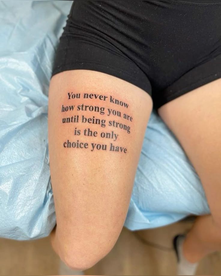 _ 23 Tattoo on thigh reading You never know how strong you are until being strong is the only choice you have in black ink. | Sky Rye Design Tattoo on thigh reading You never know how strong you are until being strong is the only choice you have in black ink.