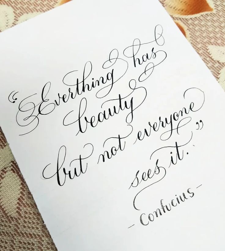 Calligraphy quote: Everything has beauty but not everyone sees it. Inspirational handwritten text on paper.