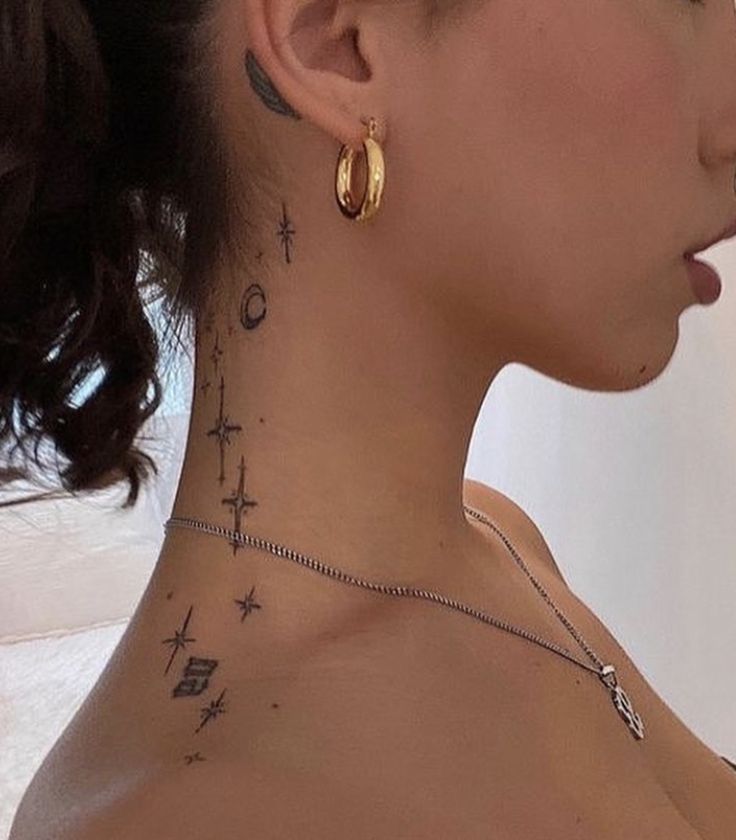 2a7a6d07c71ab82c8774428e719b05f3 Profile view of a person with celestial neck tattoos and gold hoop earring. | Sky Rye Design Profile view of a person with celestial neck tattoos and gold hoop earring.