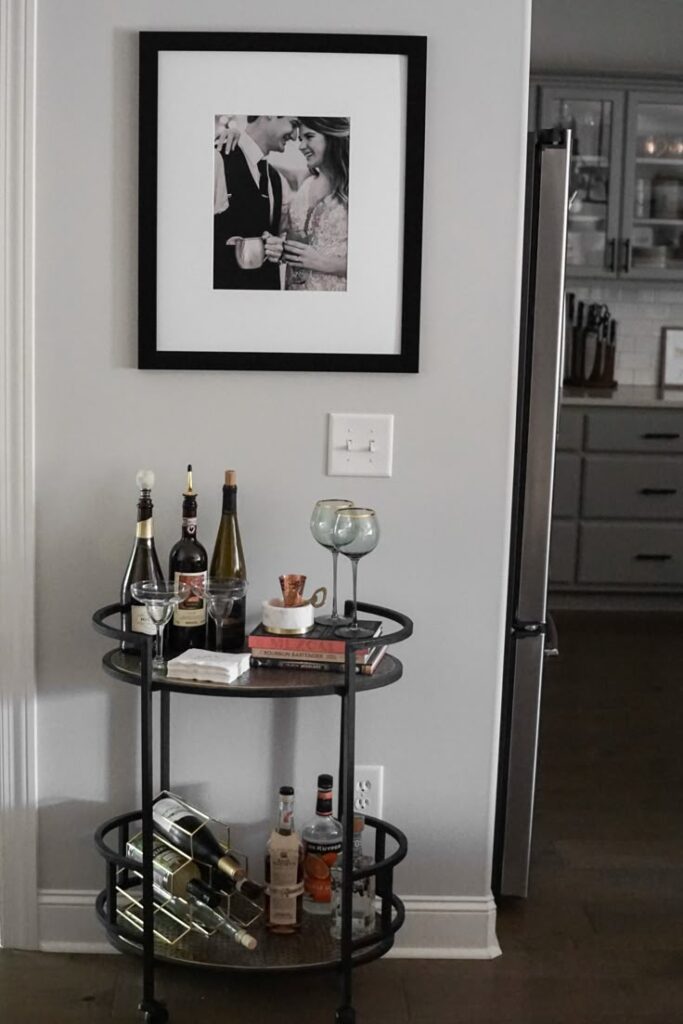 2a8a4a546233c5058105bd98cef840ef Stylish home bar cart with drinks, glasses, and a framed photo on the wall for modern decor. | Sky Rye Design Stylish home bar cart with drinks, glasses, and a framed photo on the wall for modern decor.