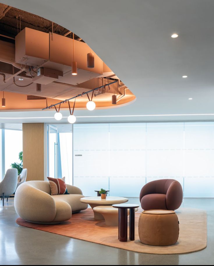 _ 3 Modern office lounge with stylish furniture, soft lighting, and contemporary decor for a welcoming atmosphere. | Sky Rye Design Modern office lounge with stylish furniture, soft lighting, and contemporary decor for a welcoming atmosphere.