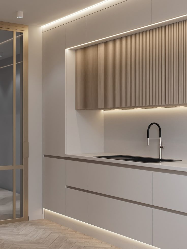 Modern kitchen with sleek cabinets, under-cabinet lighting, and a minimalist faucet design.