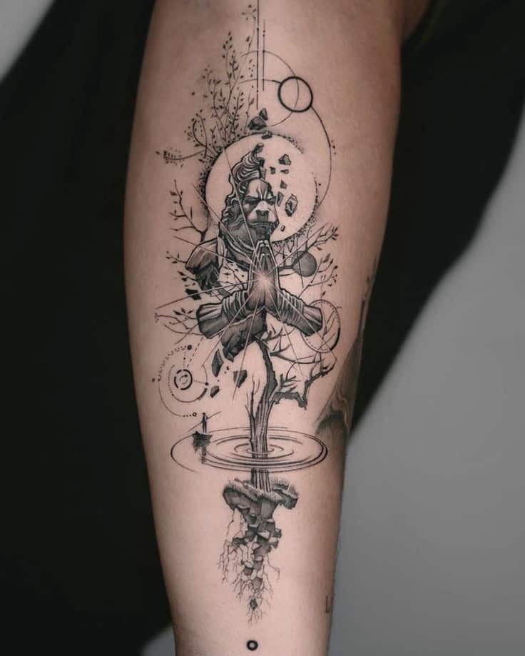 Surreal geometric tattoo featuring meditative figure, intricate lines, and abstract tree design on forearm.