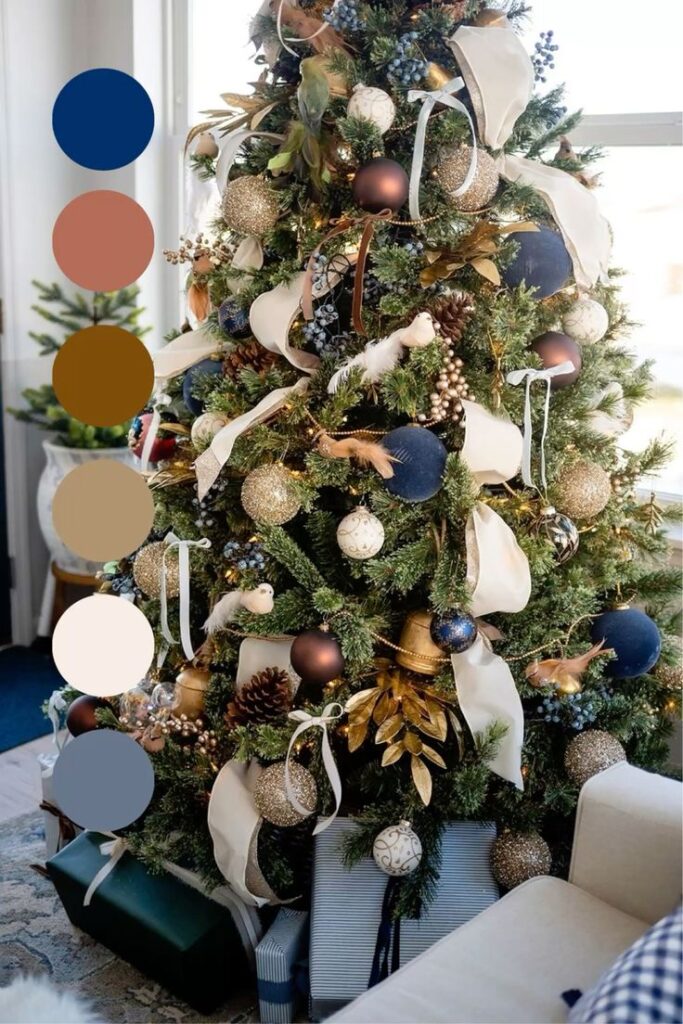 4bac03f6-cbf8-4e2b-855d-0e1f6f543cb8 Elegant Christmas tree adorned with gold and navy ornaments, ribbon, pinecones, and gift boxes in a cozy living room. | Sky Rye Design Elegant Christmas tree adorned with gold and navy ornaments, ribbon, pinecones, and gift boxes in a cozy living room.