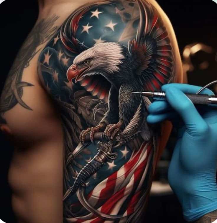 Tattoo artist inks a detailed bald eagle with American flag design on a person's arm.