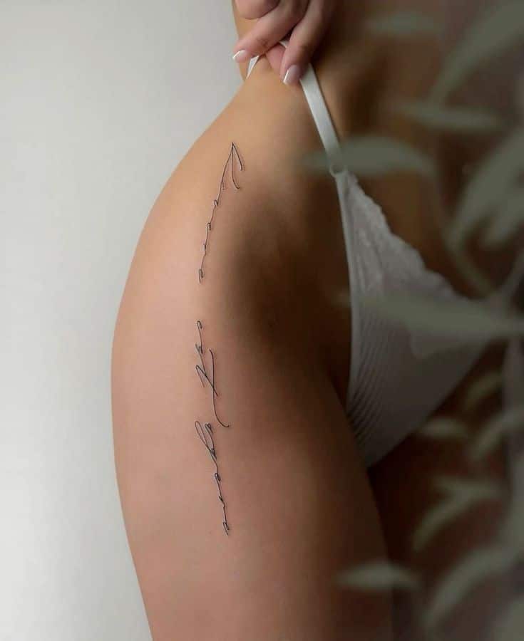_ 5 Elegant side tattoo in cursive script on a woman's hip, wearing white lingerie; art and body ink concept. | Sky Rye Design Elegant side tattoo in cursive script on a woman's hip, wearing white lingerie; art and body ink concept.