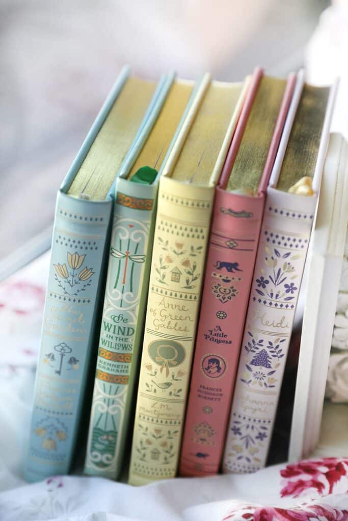 515e2b34a3aafbd704384230328e664c Colorful classic books lined up on a shelf with decorative spines, perfect for a cozy reading nook. | Sky Rye Design Colorful classic books lined up on a shelf with decorative spines, perfect for a cozy reading nook.