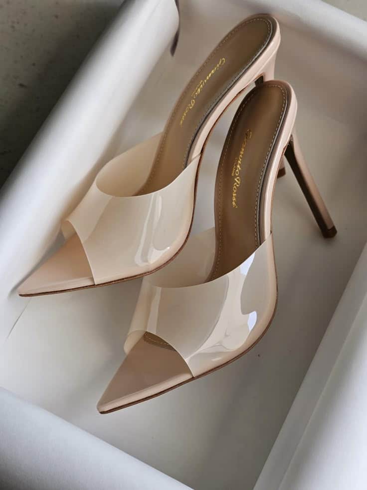 5427dbea-291d-44d5-b5f1-991027fa4afa Elegant beige high heels with clear straps in a white box. Perfect for stylish and modern fashion. | Sky Rye Design Elegant beige high heels with clear straps in a white box. Perfect for stylish and modern fashion.
