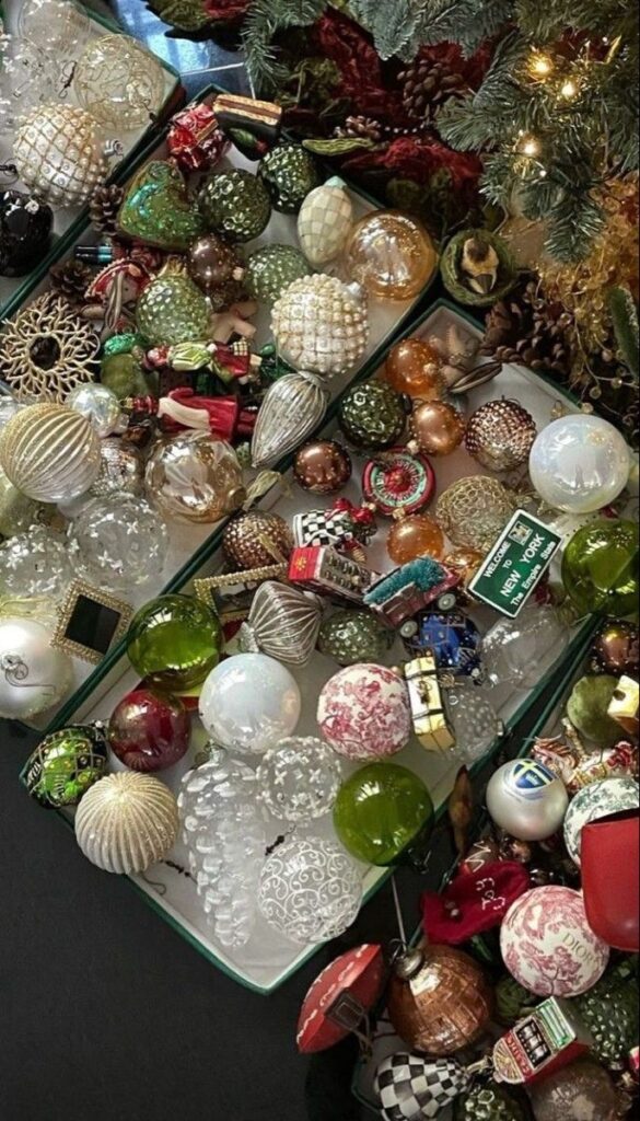 Assorted Christmas ornaments in a box, featuring colorful baubles, perfect for holiday decoration.