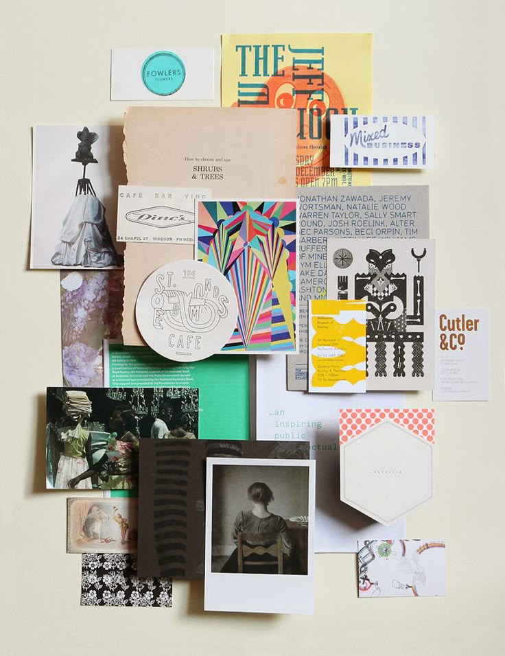 Collage of colorful brochures, postcards, and vintage photos arranged on a flat surface, showcasing diverse designs.