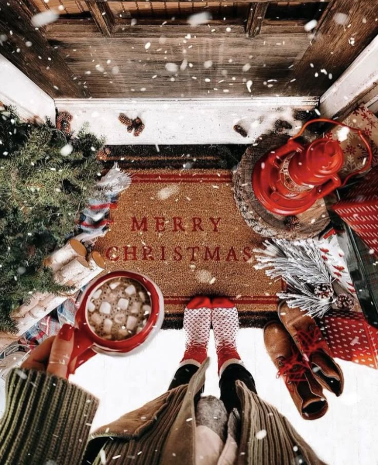 _ 6 Cozy winter scene with hot chocolate, festive doormat, boots, and snowy decor, celebrating Merry Christmas at the doorstep. | Sky Rye Design Cozy winter scene with hot chocolate, festive doormat, boots, and snowy decor, celebrating Merry Christmas at the doorstep.