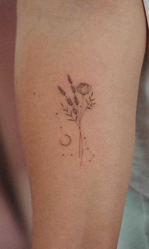 _ 6 Delicate floral tattoo with lavender and poppy design on forearm, featuring crescent moon accents. | Sky Rye Design Delicate floral tattoo with lavender and poppy design on forearm, featuring crescent moon accents.