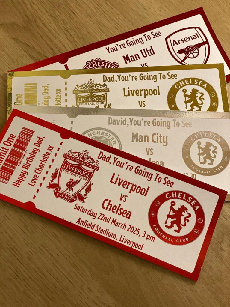 Tickets to football matches: Liverpool vs Chelsea, Man Utd vs Arsenal, Man City, on a wooden table.