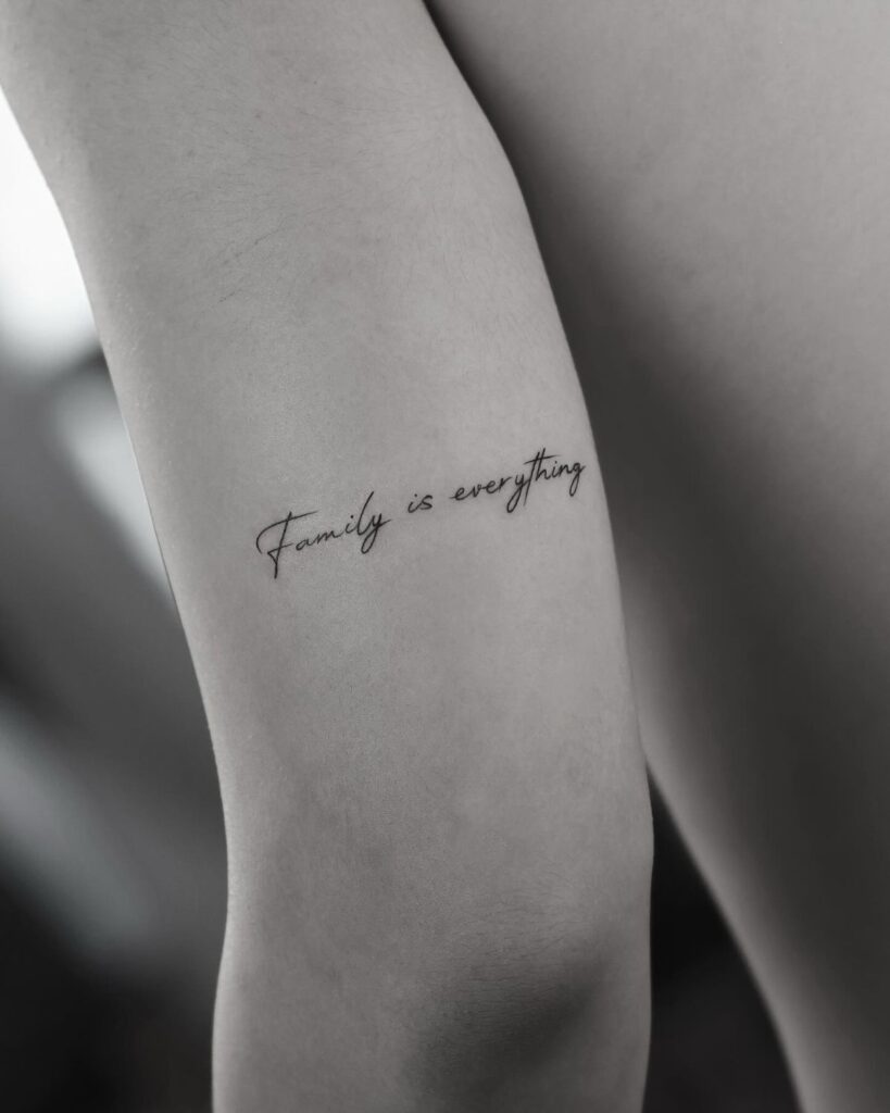 777c43e884d45c830ec9526547ef340a Close-up of arm tattoo reading Family is everything in elegant script. Inspirational body art design. | Sky Rye Design Close-up of arm tattoo reading Family is everything in elegant script. Inspirational body art design.