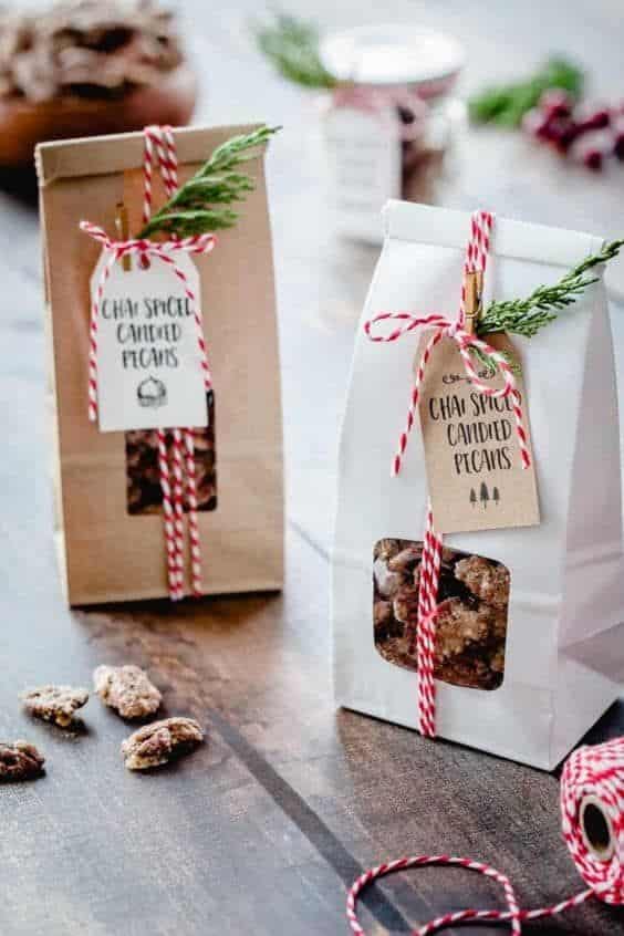 _ 8 Chai spice candied pecans in festive packaging with red string, perfect for holiday gifts. | Sky Rye Design Chai spice candied pecans in festive packaging with red string, perfect for holiday gifts.