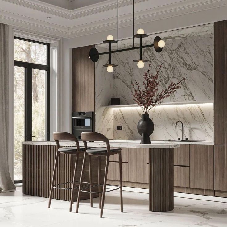 Modern kitchen with marble backsplash, wooden cabinets, island seating, chic lighting, and large window.