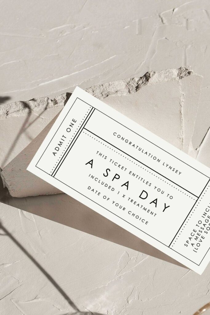 Gift certificate for a relaxing spa day, on a textured background, offering one treatment of choice.