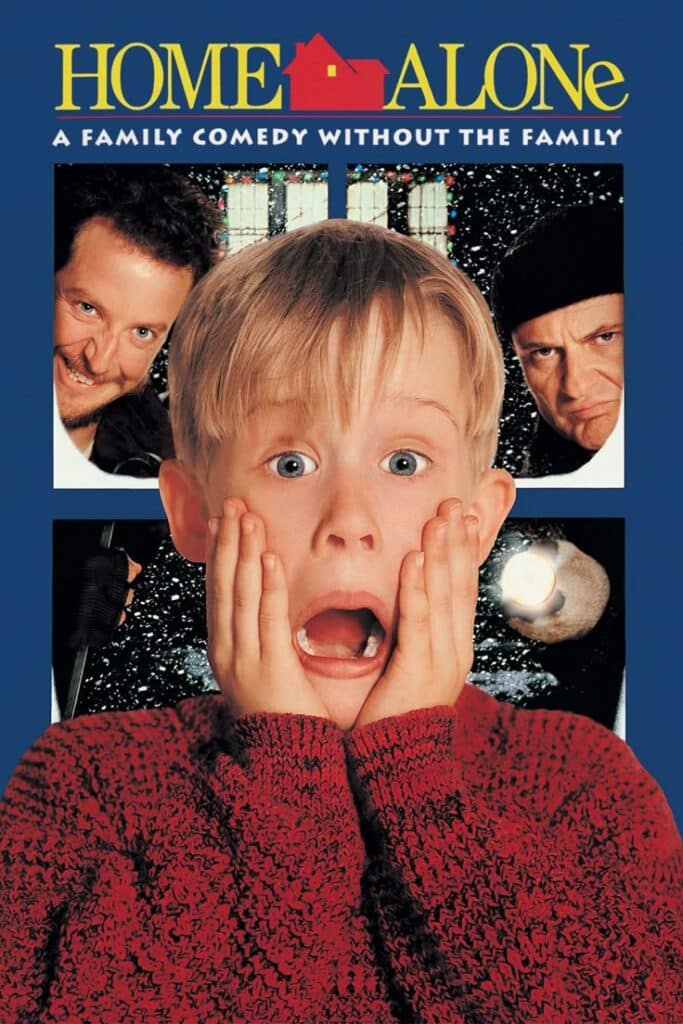 Child surprised in red sweater, flanked by two men in a festive setting. Iconic holiday movie poster.