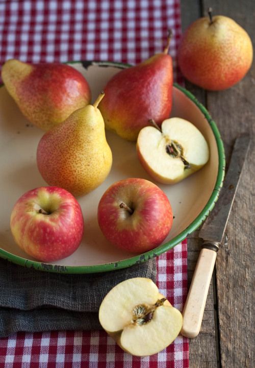 9f6f807f-1bfb-465d-a93b-2ae9b7b0fa62 Fresh pears and apples on a rustic plate with a wooden knife on a checkered cloth. | Sky Rye Design Fresh pears and apples on a rustic plate with a wooden knife on a checkered cloth.