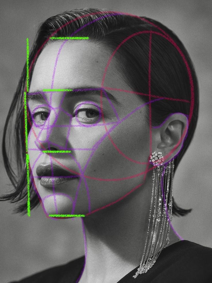 Artistic portrait with geometric face overlay, showcasing intricate earrings and elegant short hair.