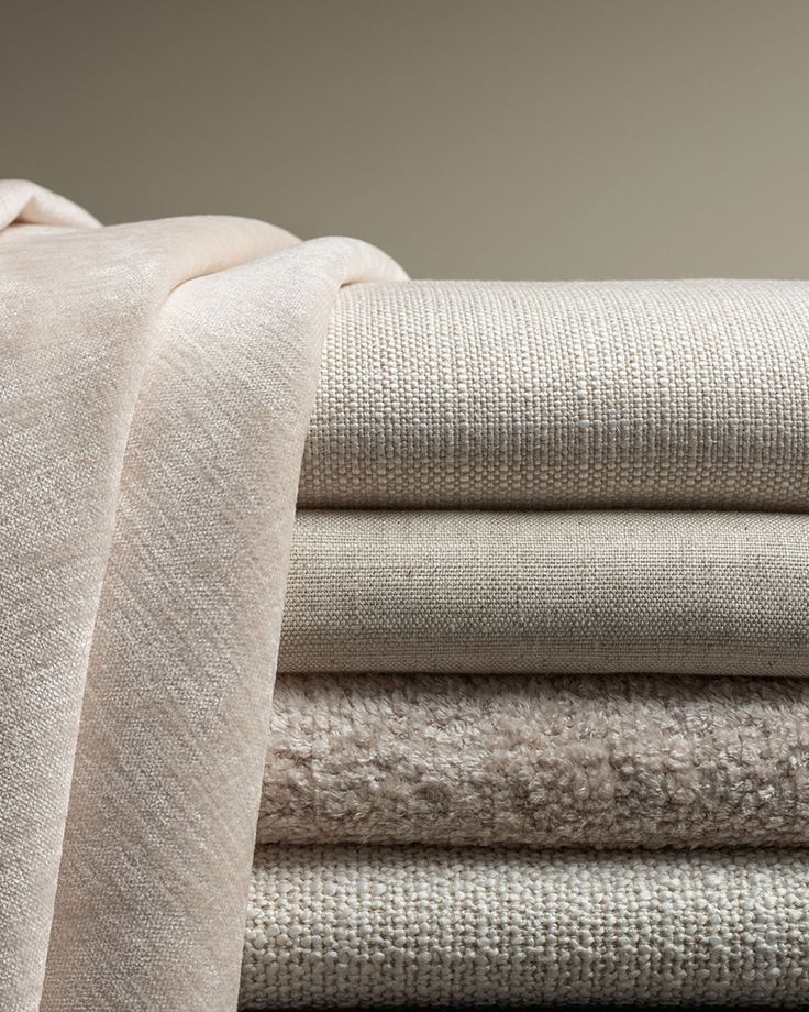 Architectuur stopt niet bij de leefruimtes_ Ook de Stack of beige and cream folded fabrics with various textures, ideal for home decor and upholstery projects. | Sky Rye Design Stack of beige and cream folded fabrics with various textures, ideal for home decor and upholstery projects.
