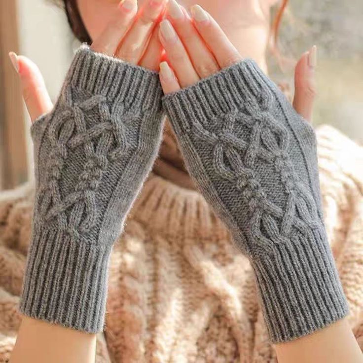 Autumn Winter Knitted Fried Dough Twists Warm Gloves for Women Solid Color Soft Skin Thickened Half Gray knitted fingerless gloves with cable pattern, worn by a person indoors in cozy setting. | Sky Rye Design Gray knitted fingerless gloves with cable pattern, worn by a person indoors in cozy setting.