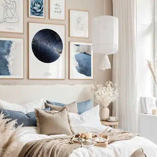 Cozy bedroom with modern art gallery wall, neutral bedding, and soft lighting for a serene, stylish ambiance.