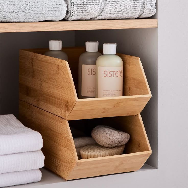 Brockton Bamboo Stacking Boxes Set of 2 Bamboo shelf with toiletries, towels, and natural brushes for organized bathroom storage. | Sky Rye Design Bamboo shelf with toiletries, towels, and natural brushes for organized bathroom storage.