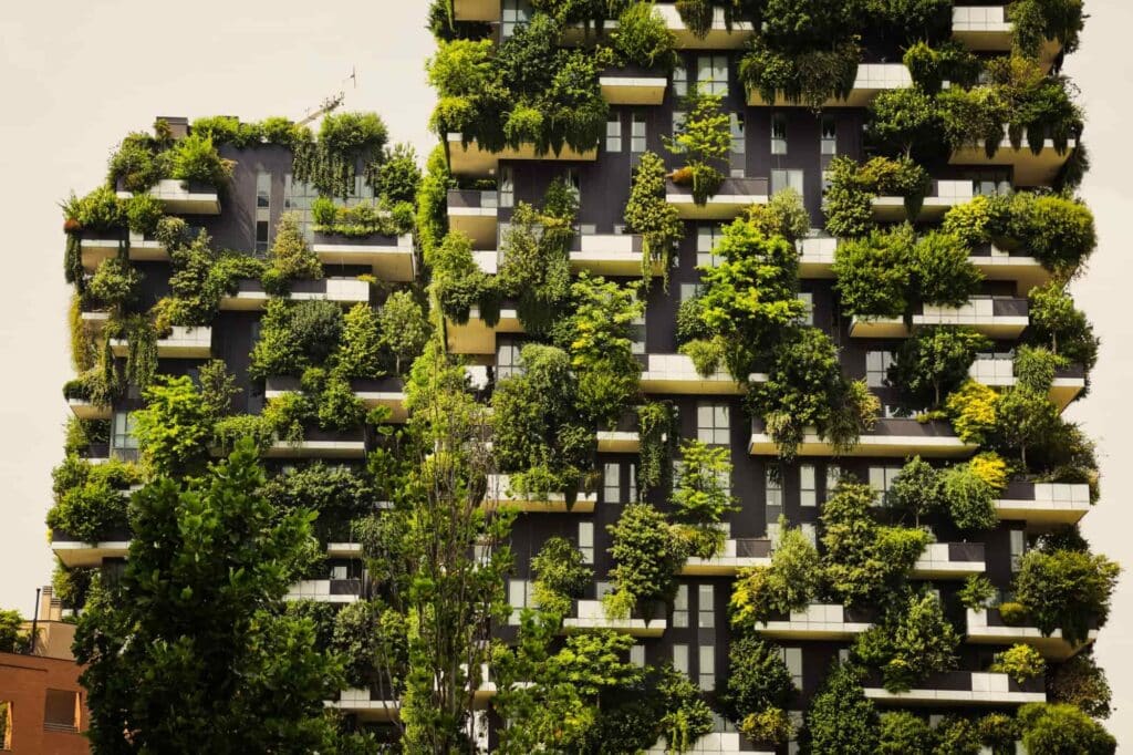 Building_with_greenry Green skyscraper with lush balconies covered in plants and trees, showcasing urban sustainability and eco-friendly architecture. | Sky Rye Design Green skyscraper with lush balconies covered in plants and trees, showcasing urban sustainability and eco-friendly architecture.