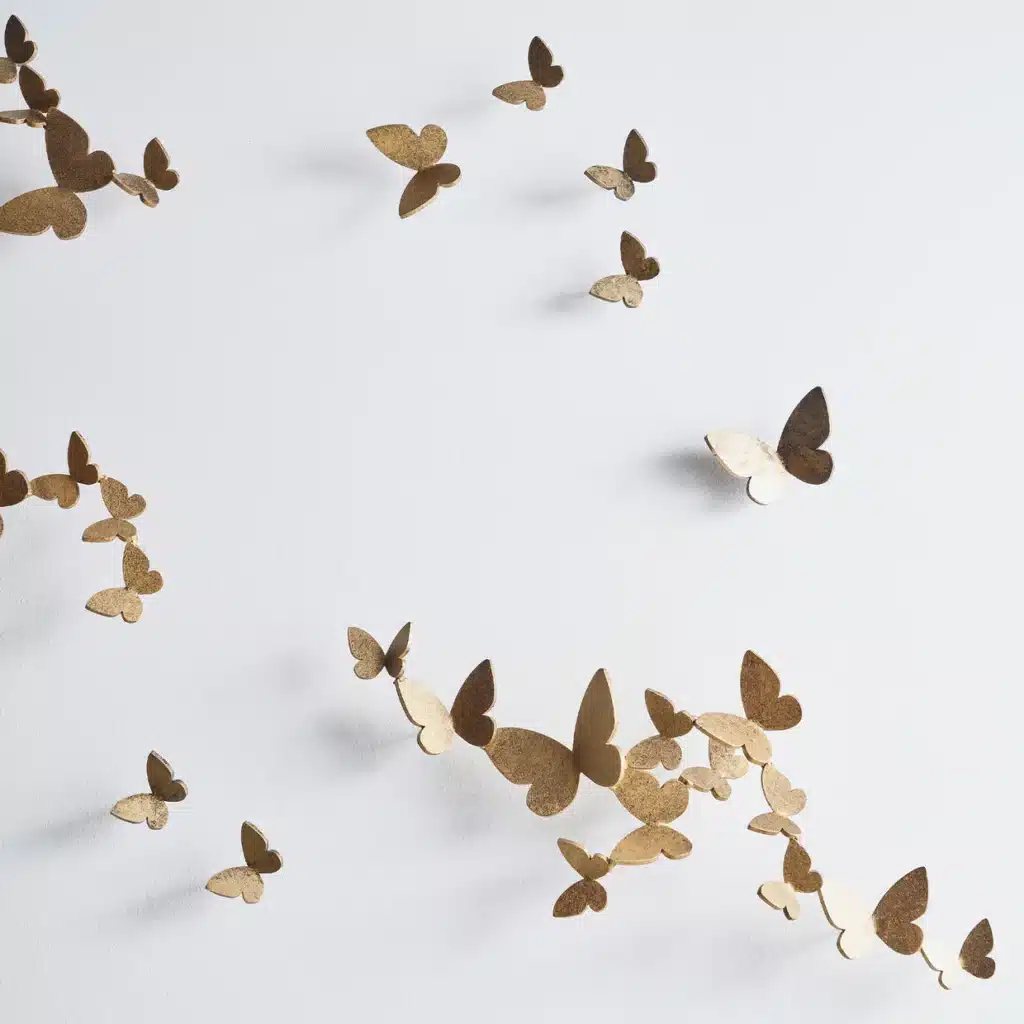 ButterflyWallDecor_ClaireCrowe_detail-web Gold butterfly wall decorations in artistic arrangement on a white background. | Sky Rye Design Gold butterfly wall decorations in artistic arrangement on a white background.