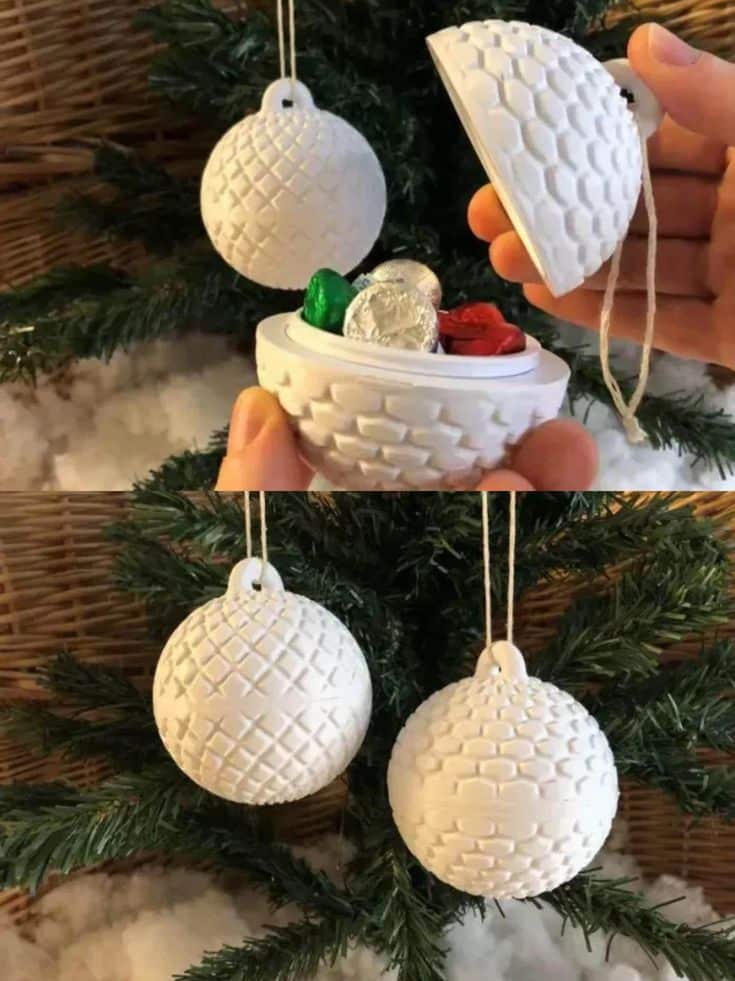 White Christmas ornament ball on tree opens to reveal hidden candies inside. Unique holiday decoration idea.