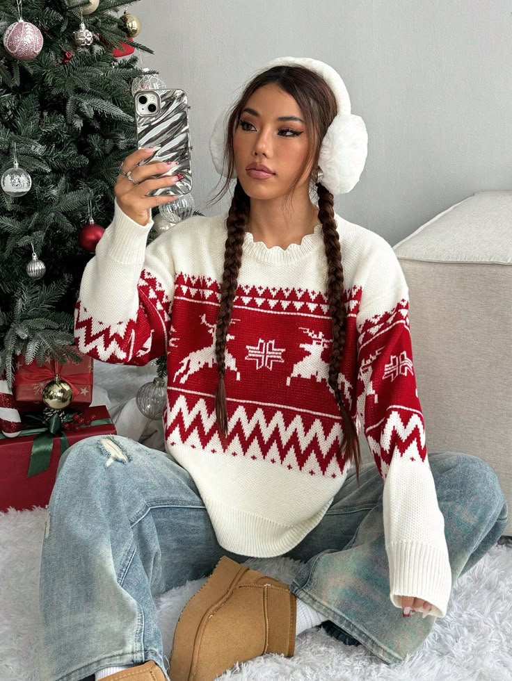 Christmas Versatile Casual Contrast Color Reindeer Geometric Pattern Sweater Woman wearing festive sweater and earmuffs, taking selfie by Christmas tree with ornaments and gifts. | Sky Rye Design Woman wearing festive sweater and earmuffs, taking selfie by Christmas tree with ornaments and gifts.