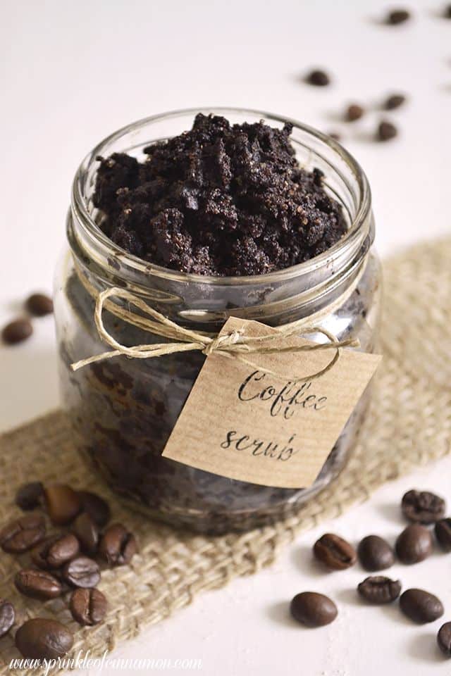 Coffee scrub - Sprinkle of cinnamon Jar of homemade coffee scrub with scattered coffee beans on burlap mat. Eco-friendly skincare product. | Sky Rye Design Jar of homemade coffee scrub with scattered coffee beans on burlap mat. Eco-friendly skincare product.