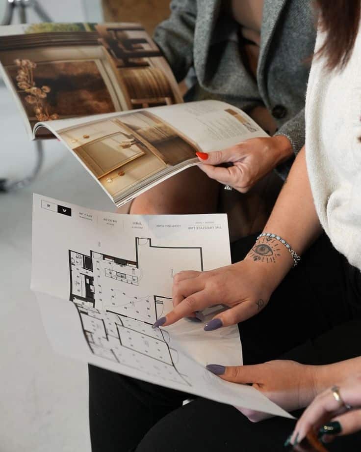 Collaborating and perfecting the details to make your dream home a reality our favorite thing to do✨ People reviewing architectural floor plans and interior design magazine. | Sky Rye Design People reviewing architectural floor plans and interior design magazine.
