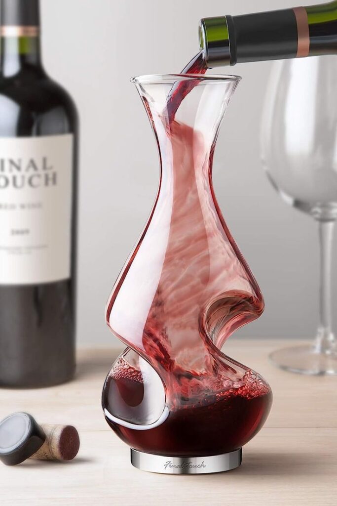 Conundrum Wine Decanter 375ml Clear Elegant red wine being poured into a modern glass decanter, bottle and cork visible, enhancing wine experience. | Sky Rye Design Elegant red wine being poured into a modern glass decanter, bottle and cork visible, enhancing wine experience.