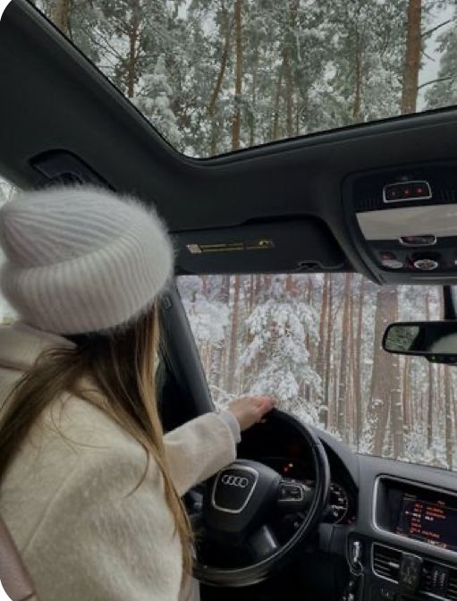 Cozy winter aesthetic Person driving an Audi through a snowy forest, seen from sunroof view. | Sky Rye Design Person driving an Audi through a snowy forest, seen from sunroof view.