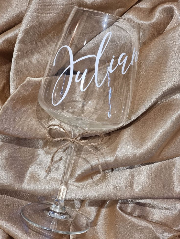 Custom Personalised Wine Glasses - Wine Glasses for Weddings Anniversaries Birthdays or Special Occasions Personalized wine glass with Julian script, on a beige satin fabric background. Elegant and stylish design. | Sky Rye Design Personalized wine glass with Julian script, on a beige satin fabric background. Elegant and stylish design.