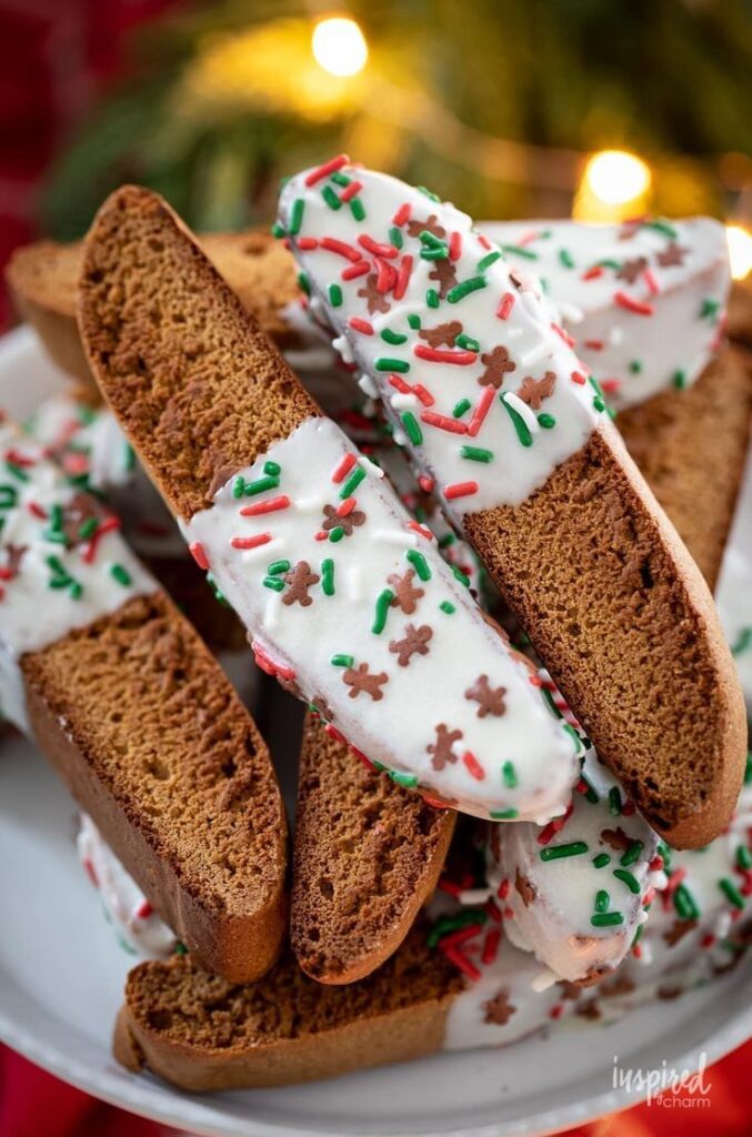 Delicious and Festive Gingerbread Biscotti gingerbread biscotti recipe coffee christmas 1 Festive biscotti dipped in white chocolate with red, green sprinkles on a plate, perfect for holiday treats. | Sky Rye Design Festive biscotti dipped in white chocolate with red, green sprinkles on a plate, perfect for holiday treats.