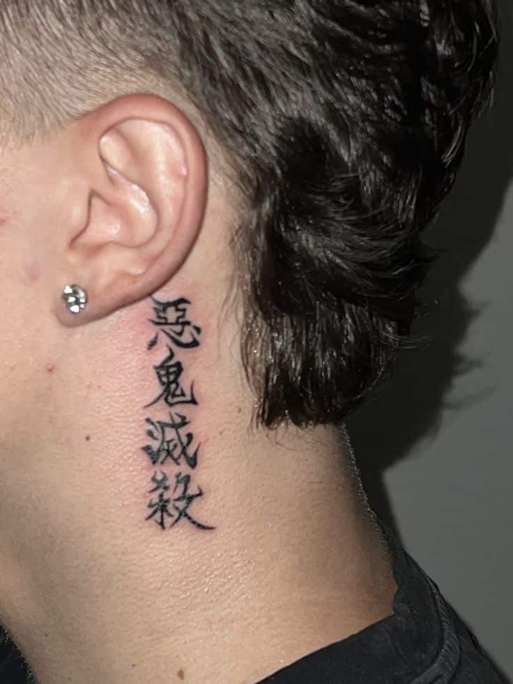 Demon slayer tt by Anthnybr on ig Neck tattoo with Chinese characters near ear and earring, featuring bold black ink on light skin. | Sky Rye Design Neck tattoo with Chinese characters near ear and earring, featuring bold black ink on light skin.