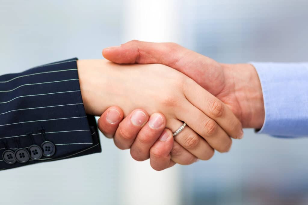 Close-up of a professional handshake, symbolizing business agreement and partnership.