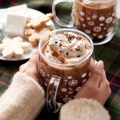 Double-Walled Snowflake Coffee Mugs Cozy winter scene with hot chocolate topped with whipped cream in snowflake mug, surrounded by cookies and marshmallows. | Sky Rye Design Cozy winter scene with hot chocolate topped with whipped cream in snowflake mug, surrounded by cookies and marshmallows.