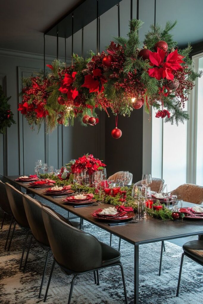 Elegant Christmas dining table with red and green decor, festive centerpiece, hanging floral display, and cozy ambiance.