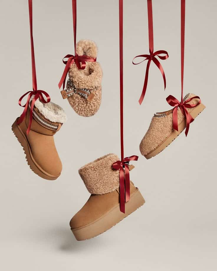 Footwear News Tan winter boots with red ribbons, suspended, showcasing cozy and stylish footwear for the season. | Sky Rye Design Tan winter boots with red ribbons, suspended, showcasing cozy and stylish footwear for the season.