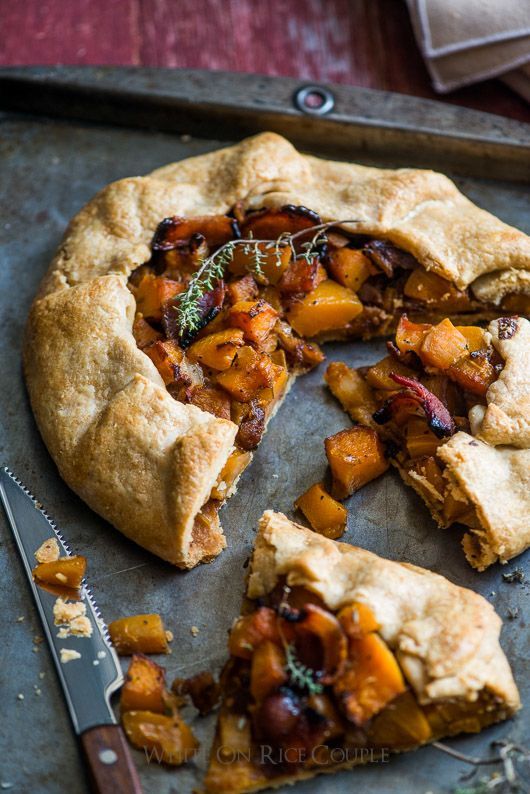 Galette Recipe with Butternut Squash Bacon and Parmesan Cheese Rustic galette with roasted squash and herbs on a baking sheet next to a knife. Perfect fall savory pastry. | Sky Rye Design Rustic galette with roasted squash and herbs on a baking sheet next to a knife. Perfect fall savory pastry.