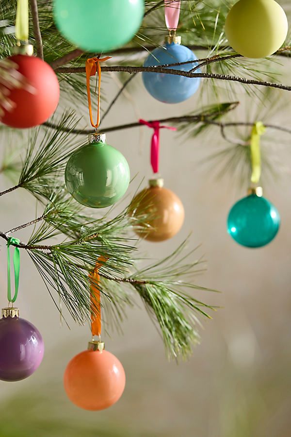Good Cheer Bauble Midi Ornaments Set of 25 Festive Christmas tree branch with colorful, glossy ornaments in green, blue, purple, and orange baubles. | Sky Rye Design Festive Christmas tree branch with colorful, glossy ornaments in green, blue, purple, and orange baubles.