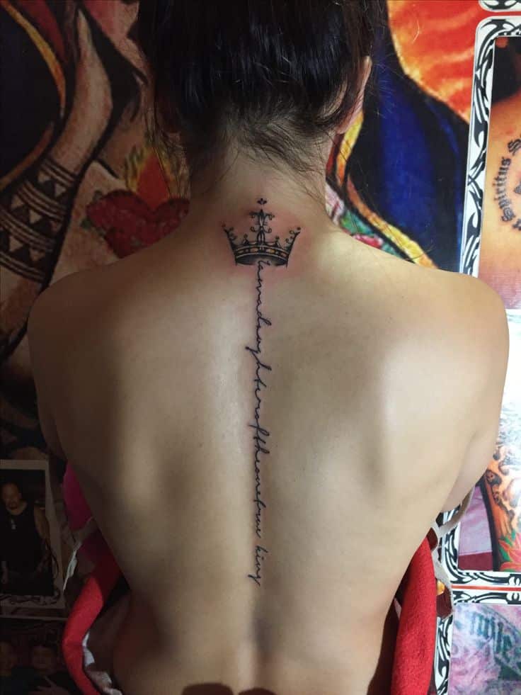 Got my own crown_👑😎 Back tattoo with a crown and script down the spine, set against a colorful background art. | Sky Rye Design Back tattoo with a crown and script down the spine, set against a colorful background art.