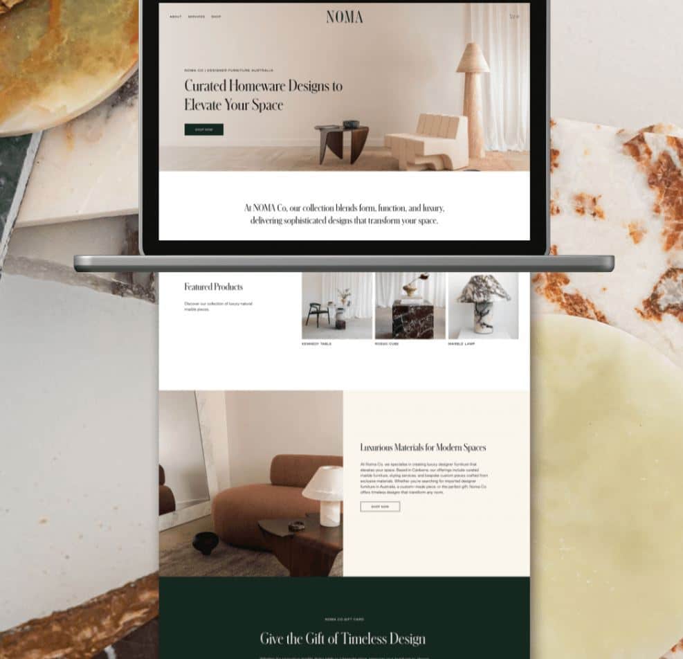 Laptop displaying a homeware design website with modern furniture focus.